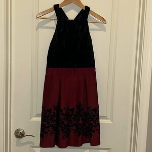 Burgundy with black velvet dress. Worn once. I’m pictured in it.